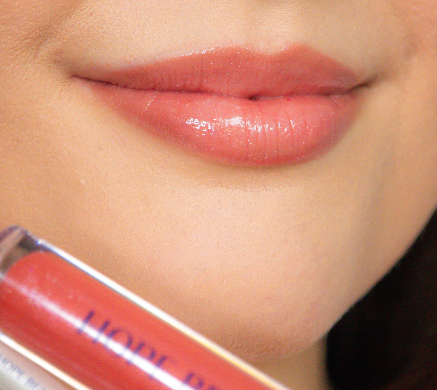 Model applies Abigail Lip Kit by Hope Beauty, inspired by Abigail from the Bible, who was known for her wisdom and beauty. Biblically inspired cosmetics. Inspirational makeup. Faith inspired makeup. Faith based company. Women of the Bible. Lip oil and lip gloss hybrid.