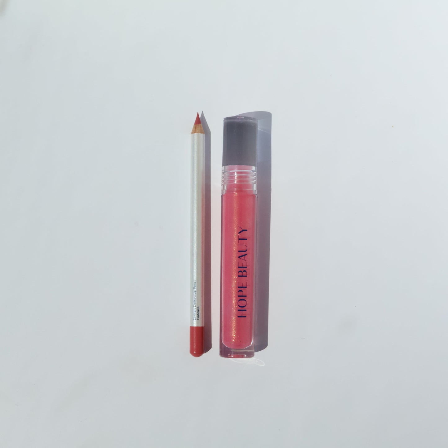 Elizabeth Lip Kit by Hope Beauty is a bubble gum pink lip liner and lip gloss set inspired by Elizabeth from the Bible. Biblically inspired makeup. Faith based company. Inspirational makeup. Lip oil and lip gloss hybrid. Long lasting lip liner.