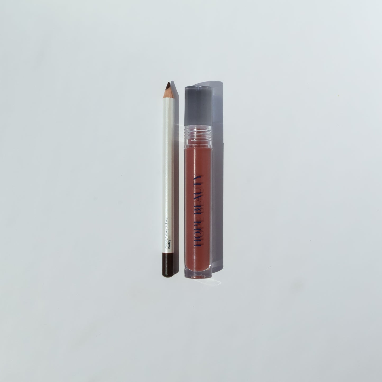 Esther Lip Kit is a lip gloss and lip liner set. Biblically inspired cosmetics. Faith inspired cosmetics. Inspirational makeup. Christian makeup. Women of the Bible. Lip oil and lip gloss hybrid.
